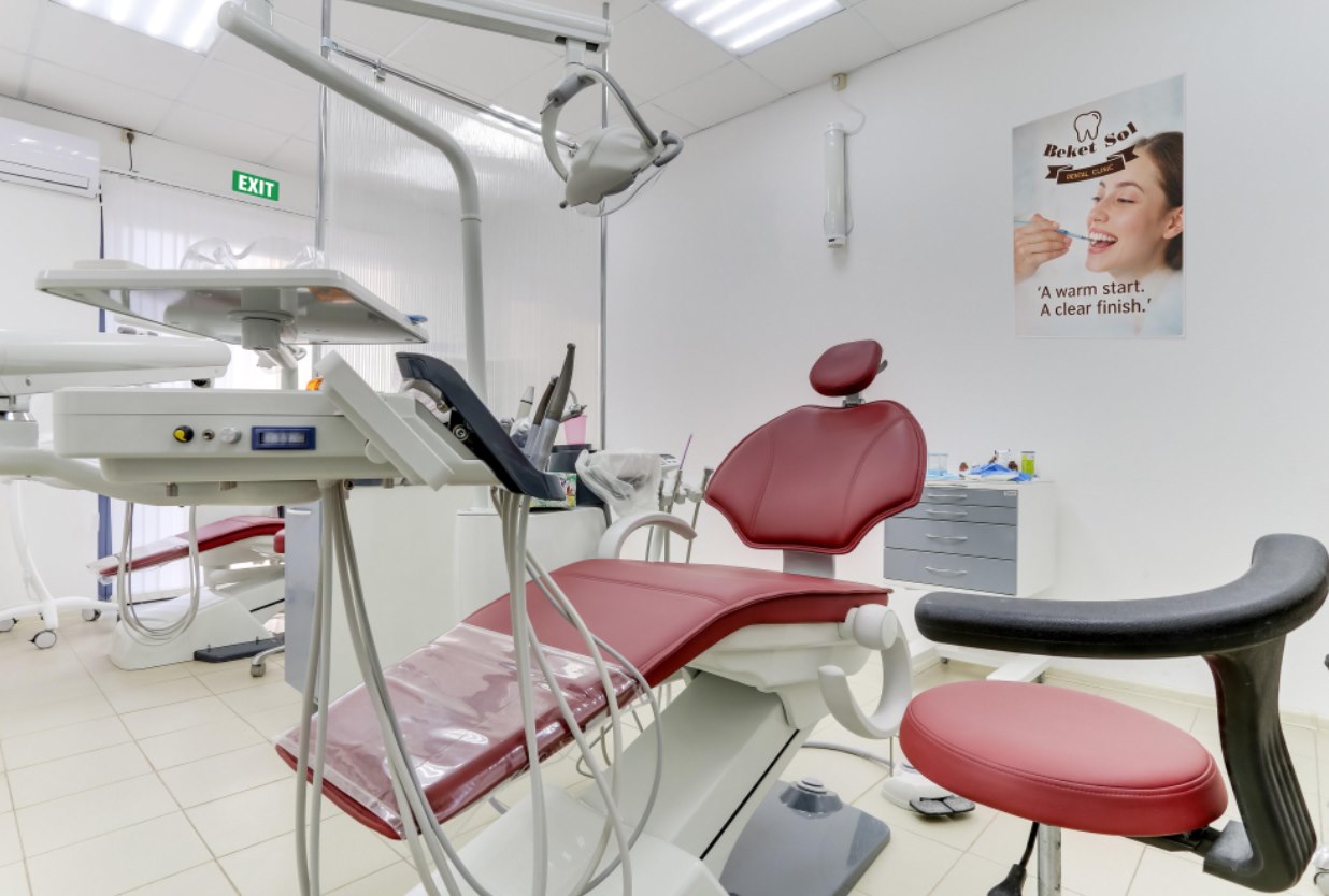 Beket Sol Dental treatment room with a burgundy dental chair